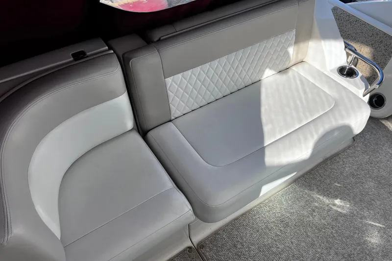 Slide: The Image of Luxurious seating on 2011 Chaparral 310 Signature boat with quilted upholstery and cup holder. - 15