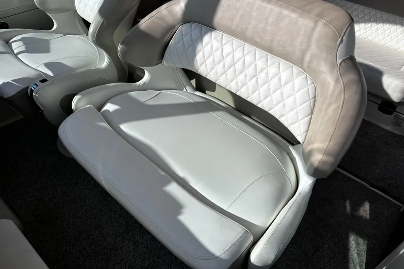 Slide: The Image of 2011 Chaparral 310 Signature boat interior with luxurious white leather seating. - 17