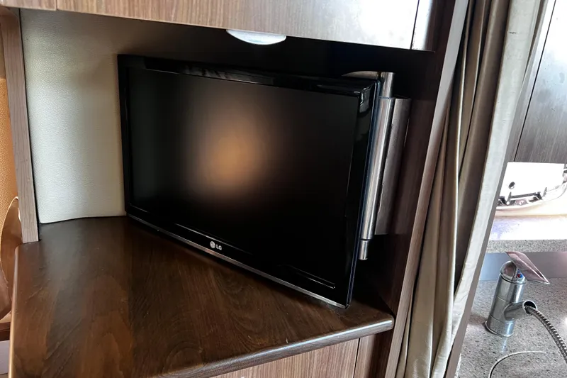 Slide: The Image of LG TV in 2011 Chaparral 310 Signature boat interior, mounted on wooden panel. - 30