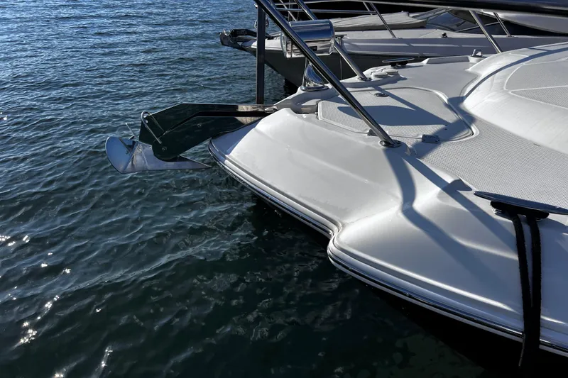 Slide: The Image of 2011 Chaparral 310 Signature boat anchored on calm water. - 35