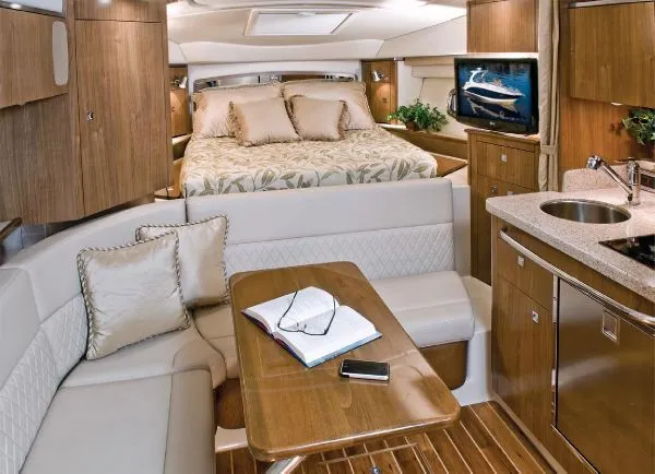 Slide: The Image of Manufacturer Provided Image: 2011 Chaparral 310 Signature boat kitchen with microwave, sink, and refrigerator. - 6