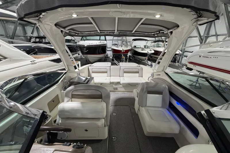Slide: The Image of Interior view of a 2012 Sea Ray 300 SLX boat in a showroom. - 21