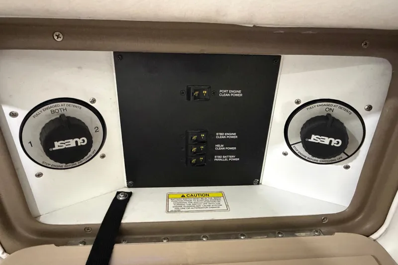 Slide: The Image of Control panel of a 2012 Sea Ray 300 SLX boat with power switches. - 36