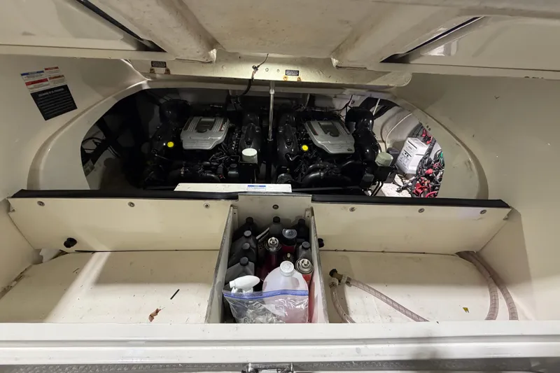 Slide: The Image of Engine compartment of a 2012 Sea Ray 300 SLX boat with maintenance supplies. - 39