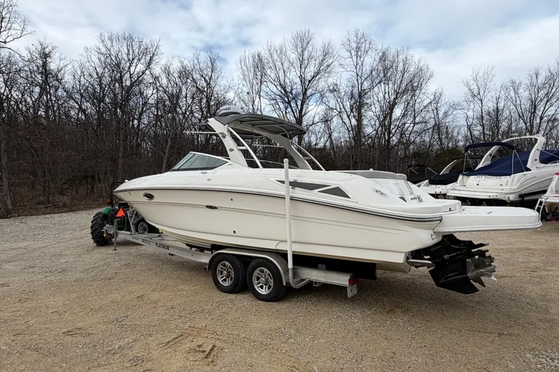 Slide: The Image of 2012 Sea Ray 300 SLX boat parked on trailer outdoors. - 4