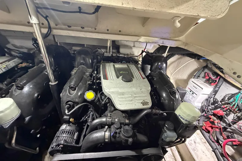 Slide: The Image of Engine compartment of a 2012 Sea Ray 300 SLX boat, showcasing detailed components. - 42