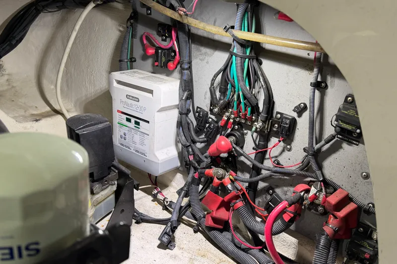 Slide: The Image of Electrical wiring and components inside a 2012 Sea Ray 300 SLX boat. - 43