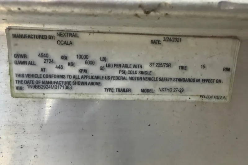 Slide: The Image of Label on trailer manufactured by Nextrail, detailing specifications and compliance information. - 44