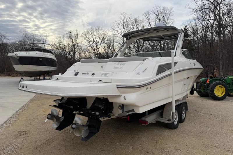 Slide: The Image of 2012 Sea Ray 300 SLX boat parked on trailer outdoors. - 6