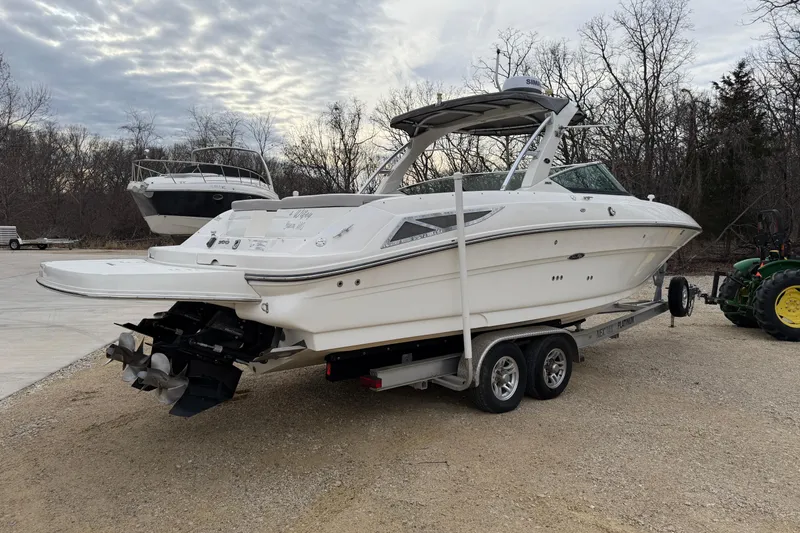 Slide: The Image of 2012 Sea Ray 300 SLX boat parked on trailer outdoors. - 7