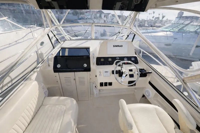 Slide: The Image of 2003 Grady-White Marlin 300 helm with Simrad navigation system and comfortable seating. - 6