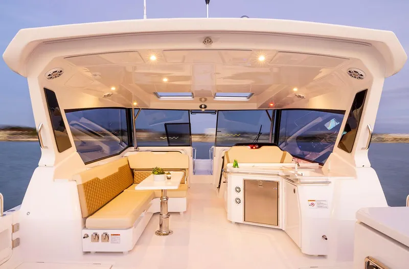 Slide: The Image of Manufacturer Provided Image: 2026 Aquila 36 Sport yacht interior with seating, table, and kitchenette. - 10