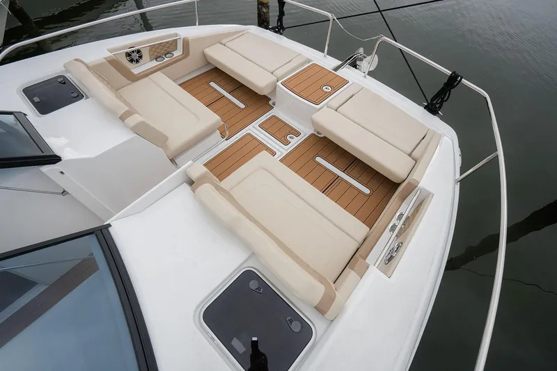 Slide: The Image of Manufacturer Provided Image: Aquila 36 Sport 2026 boat deck with beige seating and wooden flooring. - 5