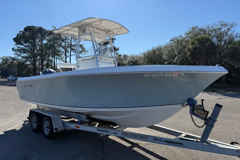 Slide: The Image of 2005 Sailfish 218 CC boat on trailer in sunny outdoor setting. - 11