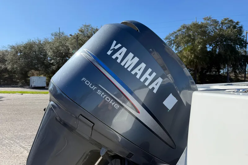 Slide: The Image of Yamaha four-stroke engine on a 2005 Sailfish 218 CC boat, outdoors. - 15