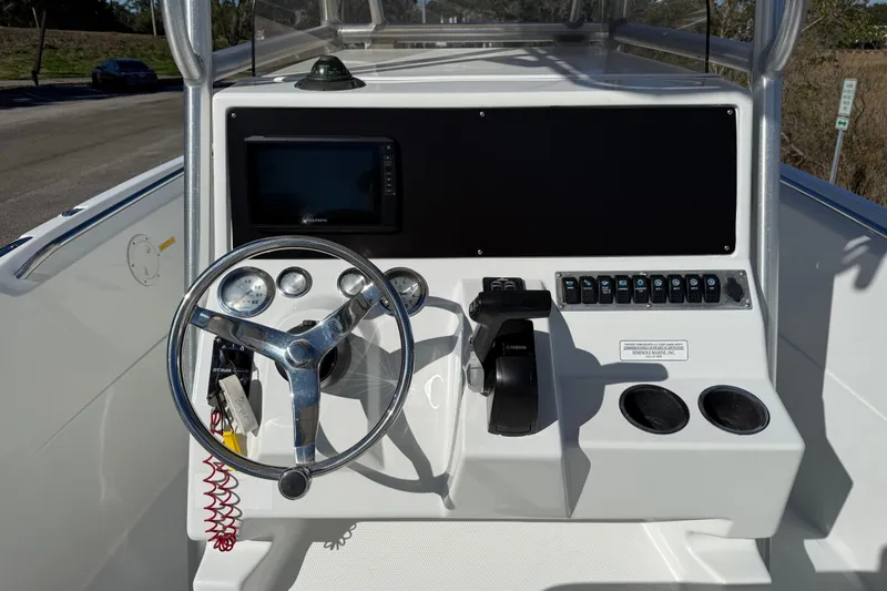 Slide: The Image of Center console of a 2005 Sailfish 218 CC boat with steering wheel and controls. - 16