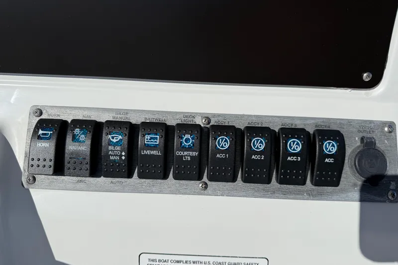 Slide: The Image of Control panel of a 2005 Sailfish 218 CC boat with labeled switches. - 20
