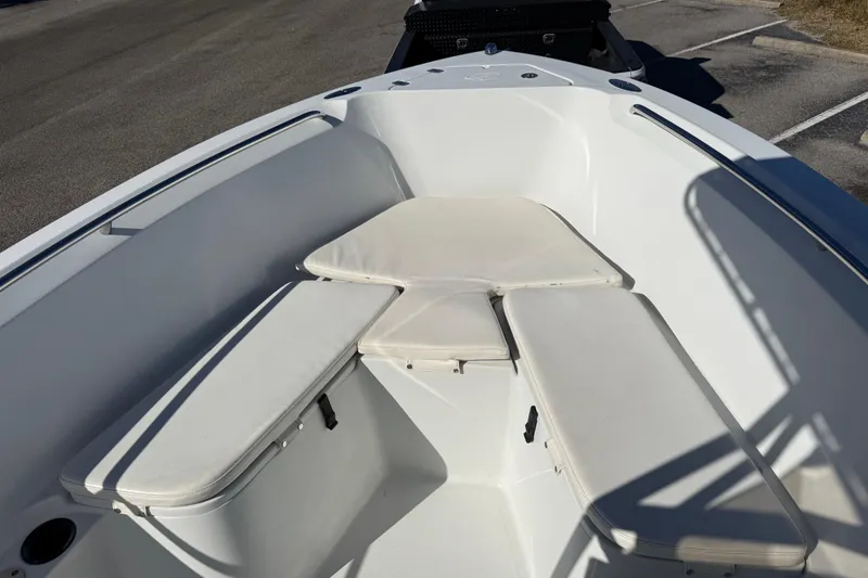 Slide: The Image of 2005 Sailfish 218 CC boat interior with cushioned seating and storage compartments. - 23