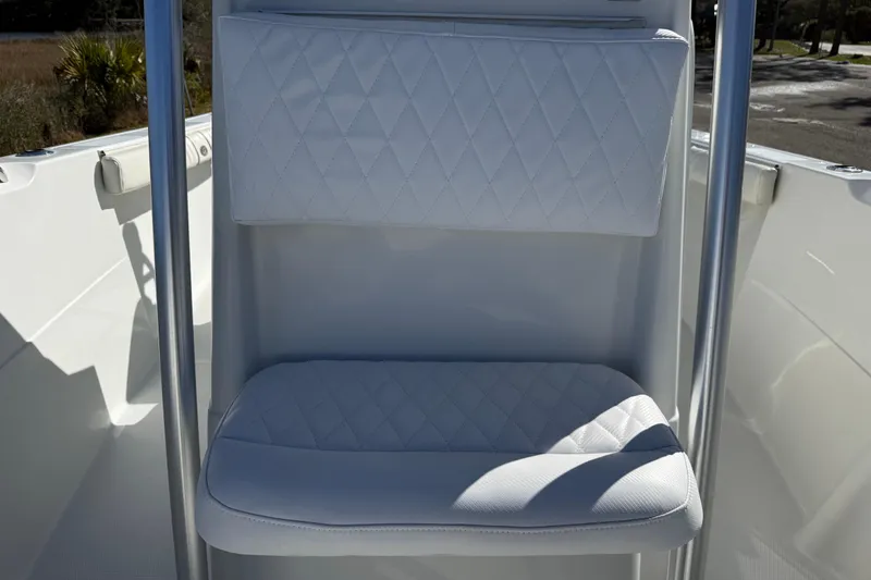 Slide: The Image of White cushioned seat on 2005 Sailfish 218 CC boat, featuring diamond stitching. - 24