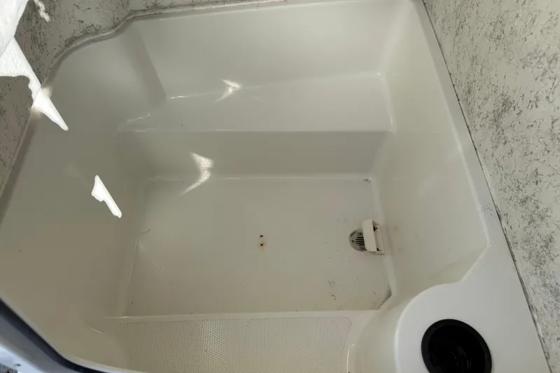 Slide: The Image of Empty storage compartment in a 2005 Sailfish 218 CC boat. - 29