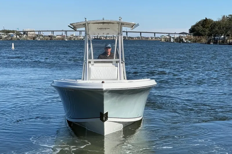 Slide: The Image of 2005 Sailfish 218 CC boat on water with bridge in background. - 5