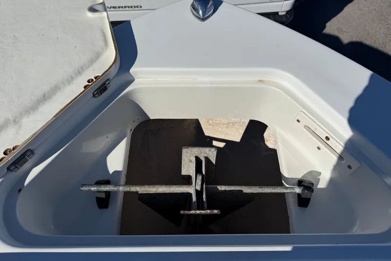 Slide: The Image of Open anchor compartment on 2005 Sailfish 218 CC boat, showing anchor storage. - 7