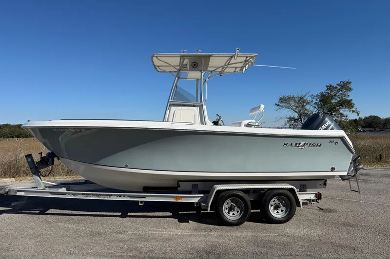 Slide: The Image of 2005 Sailfish 218 CC boat on trailer, side view, clear sky background. - 8