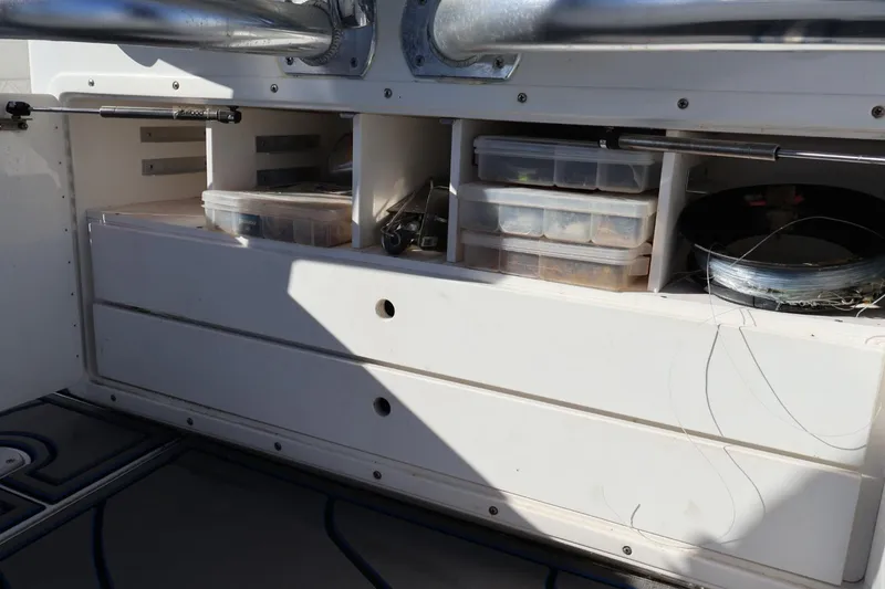 Slide: The Image of 2007 Contender 33 Tournament boat with stainless steel rod holders against blue sky. - 10