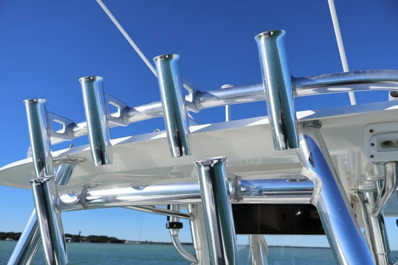 Slide: The Image of 2007 Contender 33 Tournament boat with triple Yamaha outboard engines on a sunny day. - 11