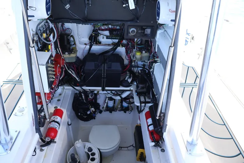 Slide: The Image of 2007 Contender 33 Tournament boat interior with steering wheel and Garmin electronics. - 16