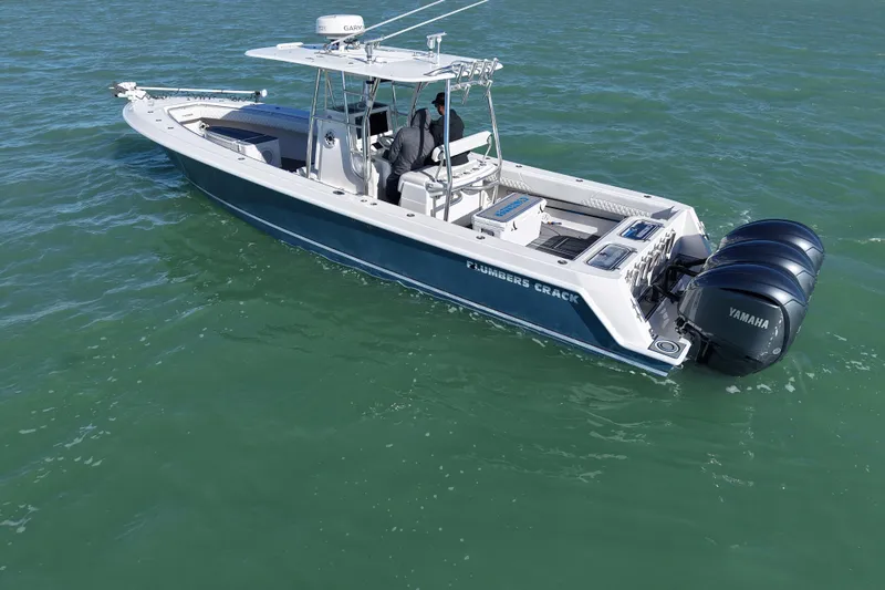 Slide: The Image of Aerial view of 2007 Contender 33 Tournament boat on green water. - 4