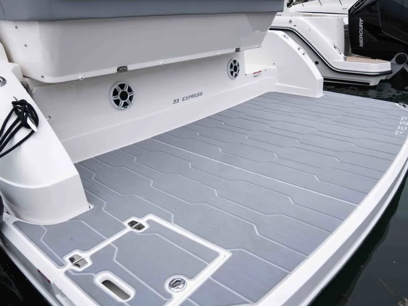 Slide: The Image of Rear view of the 2026 Regal 33 Express yacht. - 13