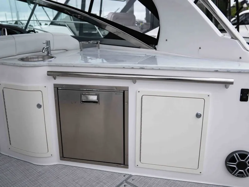 Slide: The Image of Regal 33 Express 2026: Onboard kitchenette with sink and storage. - 17