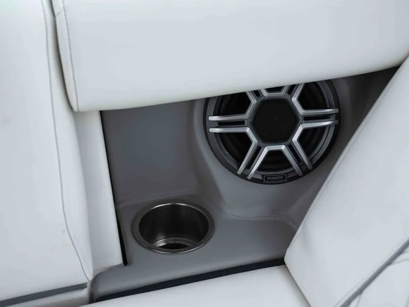 Slide: The Image of Regal 33 Express 2026 speaker and cup holder detail view. - 20