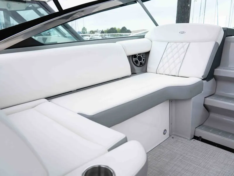 Slide: The Image of Interior of 2026 Regal 33 Express with luxurious white upholstery. - 21