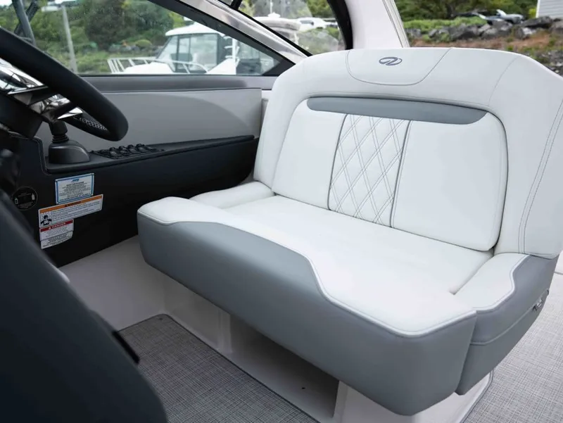 Slide: The Image of Interior of 2026 Regal 33 Express featuring luxurious seat design. - 25