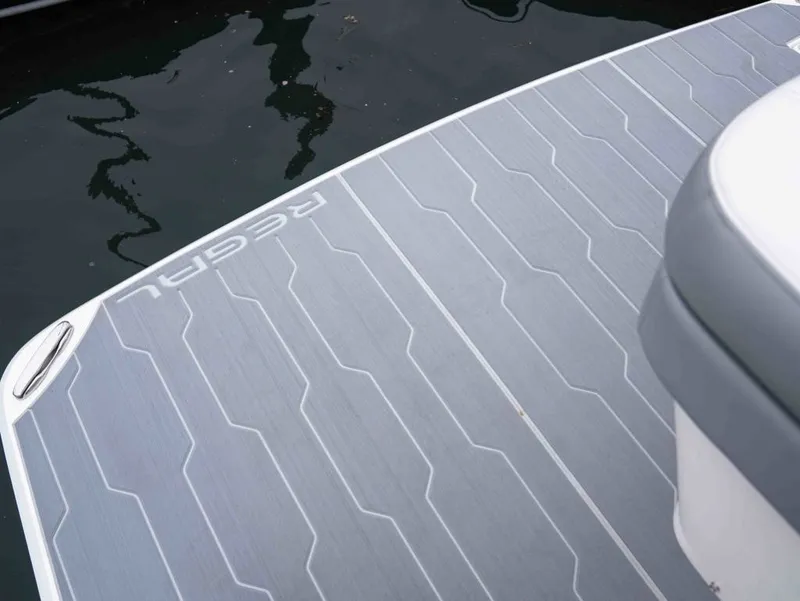 Slide: The Image of Regal 33 Express 2026 boat platform by the water. - 28
