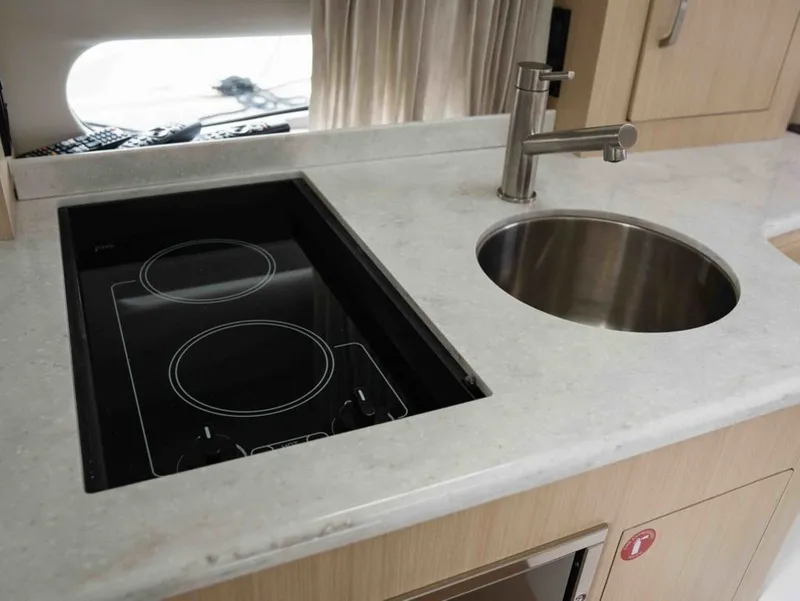 Slide: The Image of Modern kitchen in Regal 33 Express 2026 boat. - 32