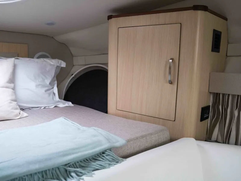 Slide: The Image of Interior of 2026 Regal 33 Express with bed and cabinet. - 35