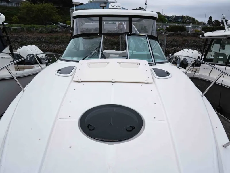 Slide: The Image of 2026 Regal 33 Express boat docked, front view. - 39