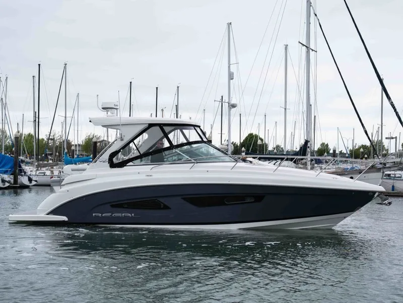 Slide: The Image of 2026 Regal 33 Express yacht docked, sleek and modern design. - 5