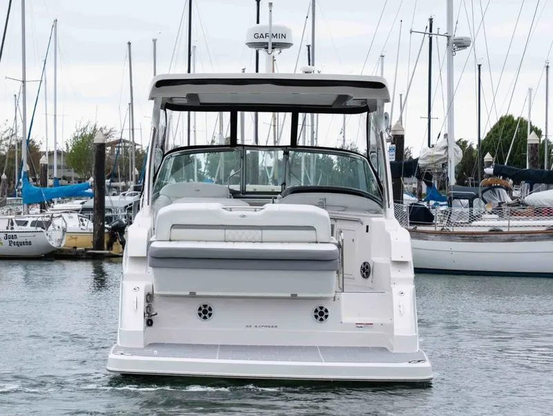 Slide: The Image of Rear view of 2026 Regal 33 Express yacht in harbor. - 7