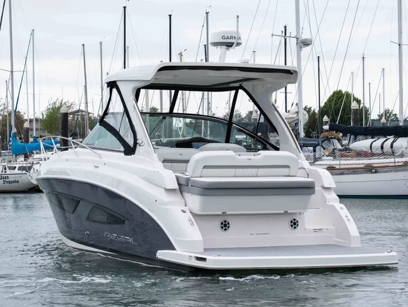 Slide: The Image of 2026 Regal 33 Express yacht in harbor, modern design. - 8