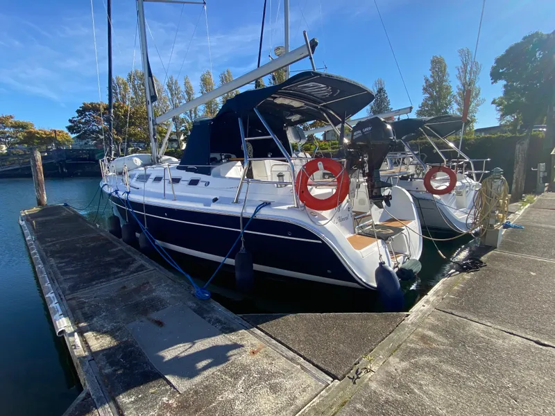 The Image of 2006 Hunter 38 sailboat docked at marina. - 0
