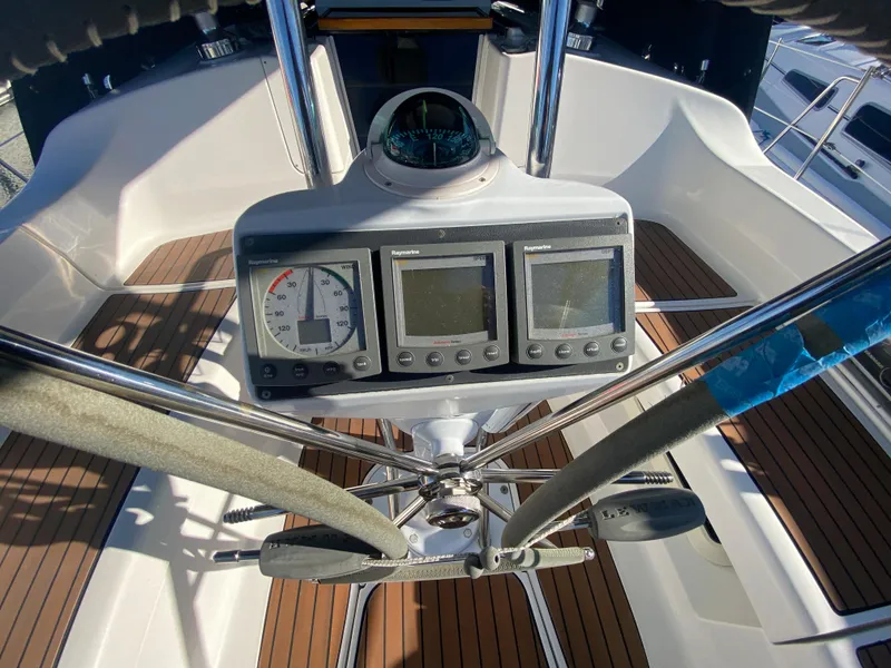 Slide: The Image of Cockpit of a 2006 Hunter 38 yacht with navigation instruments. - 13
