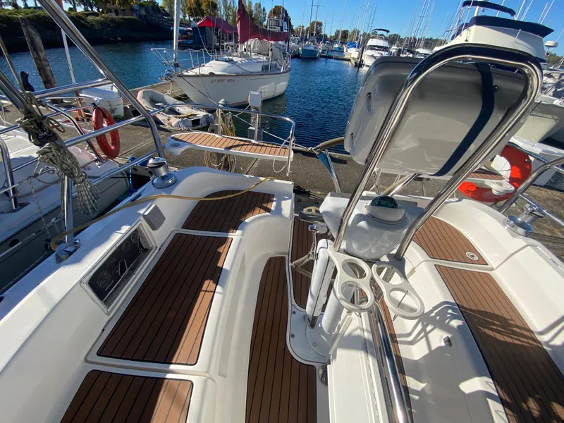 Slide: The Image of Cockpit of a 2006 Hunter 38 sailboat docked in a marina. - 16