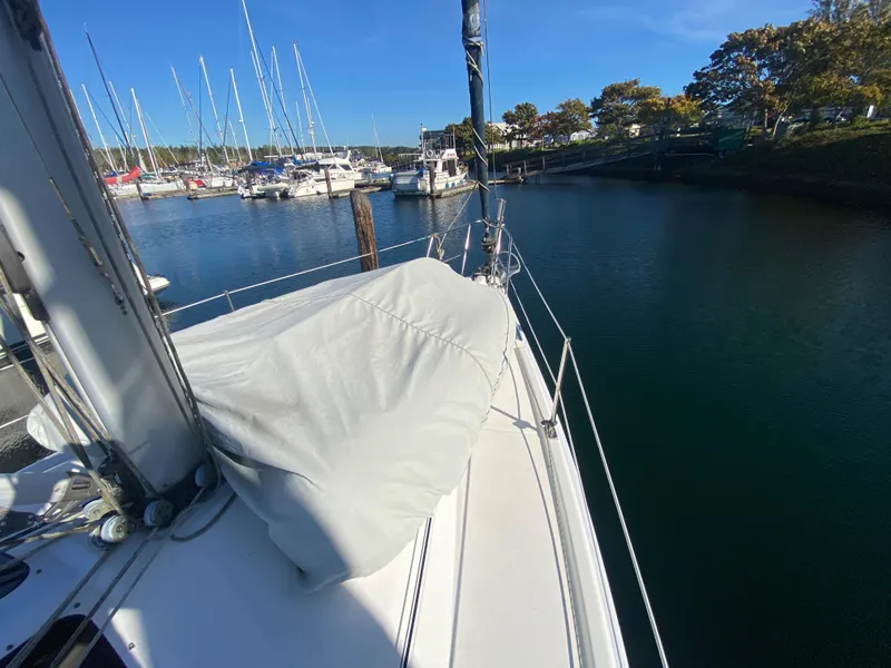 Slide: The Image of 2006 Hunter 38 sailboat docked in marina on sunny day. - 17