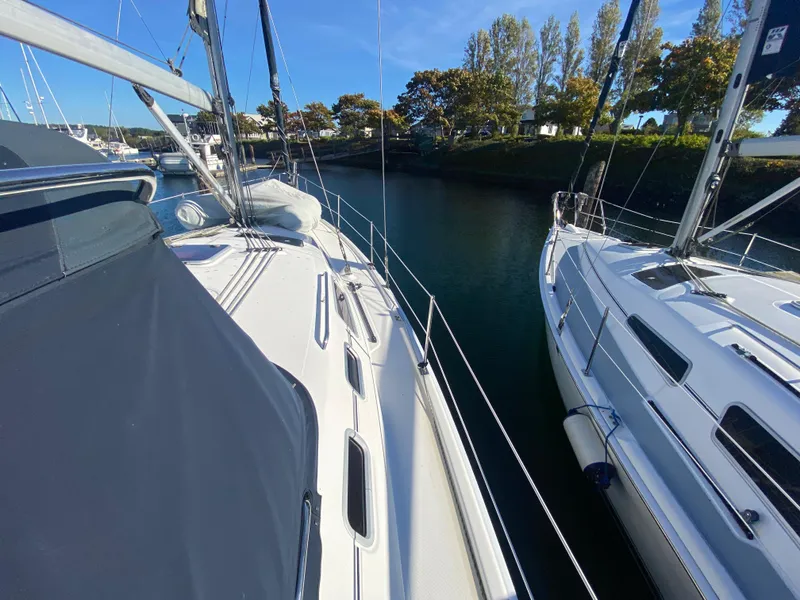 Slide: The Image of Two sailboats docked, Hunter 38, year 2006. - 18