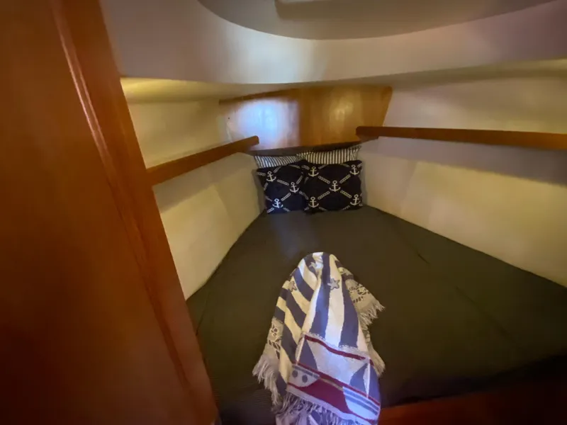 Slide: The Image of Cozy cabin in a 2006 Hunter 38 yacht. - 33