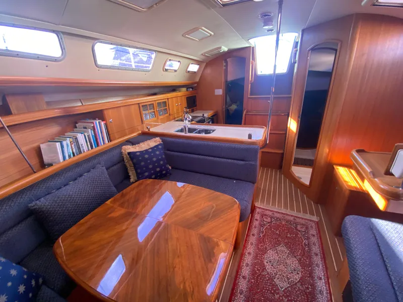 Slide: The Image of Interior of a 2006 Hunter 38 yacht with wooden furnishings. - 34